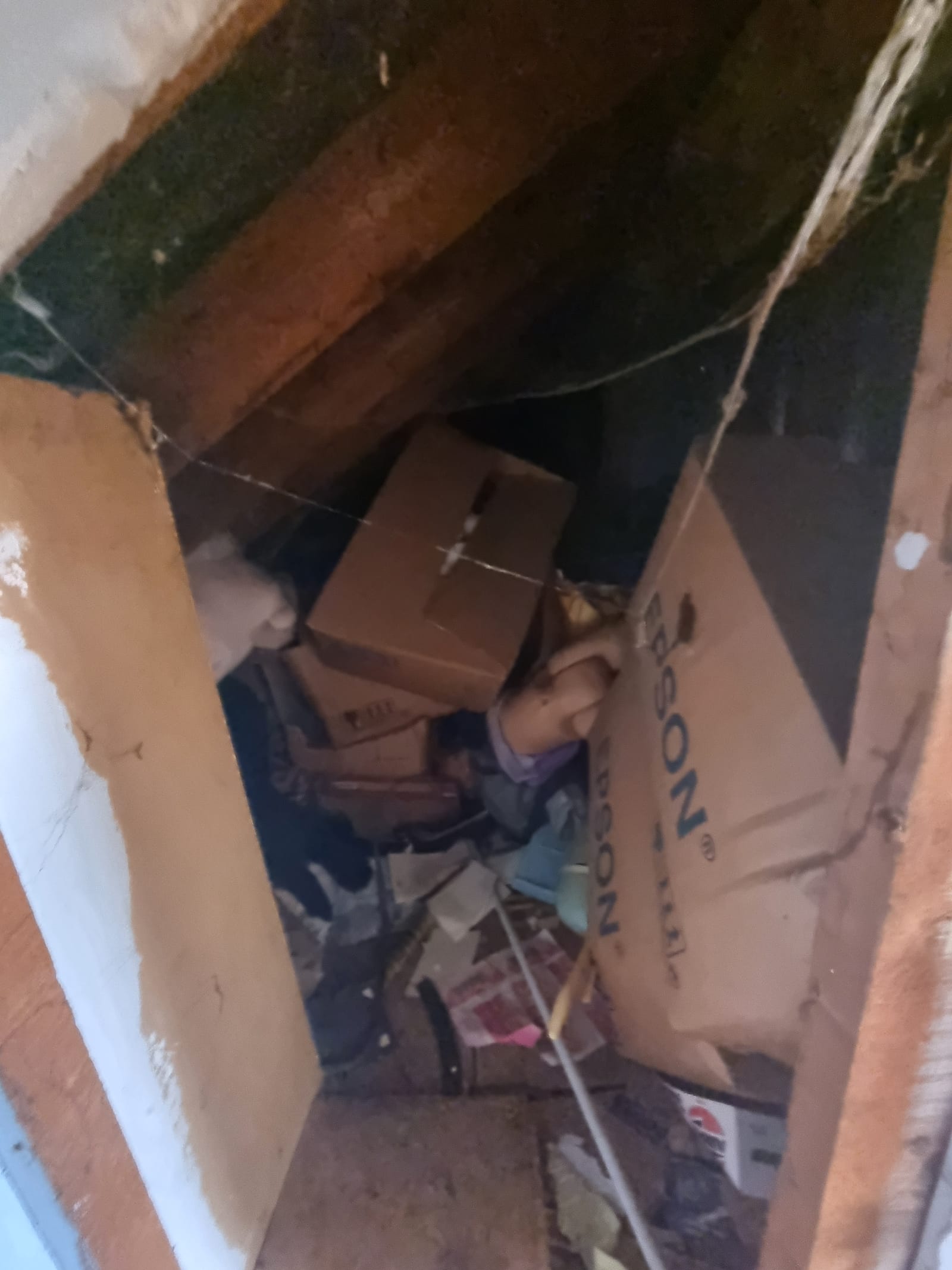 Boxes being cleared through an attic hatch