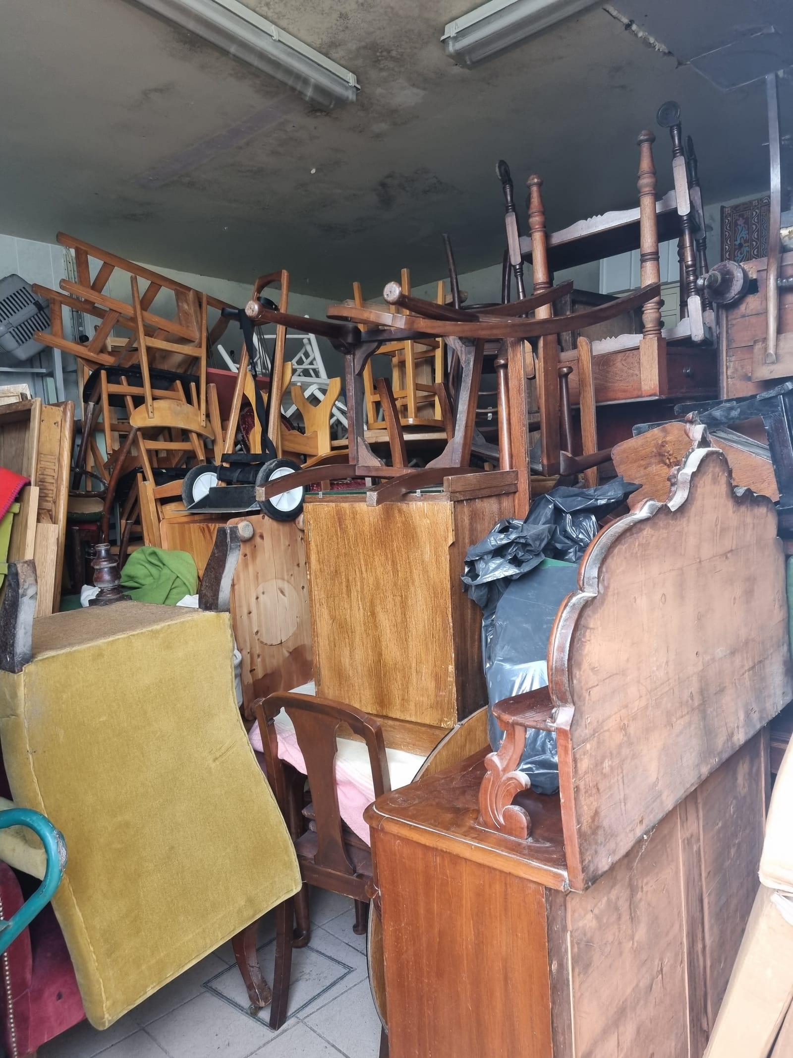A room full of furniture cleared during a house clearance