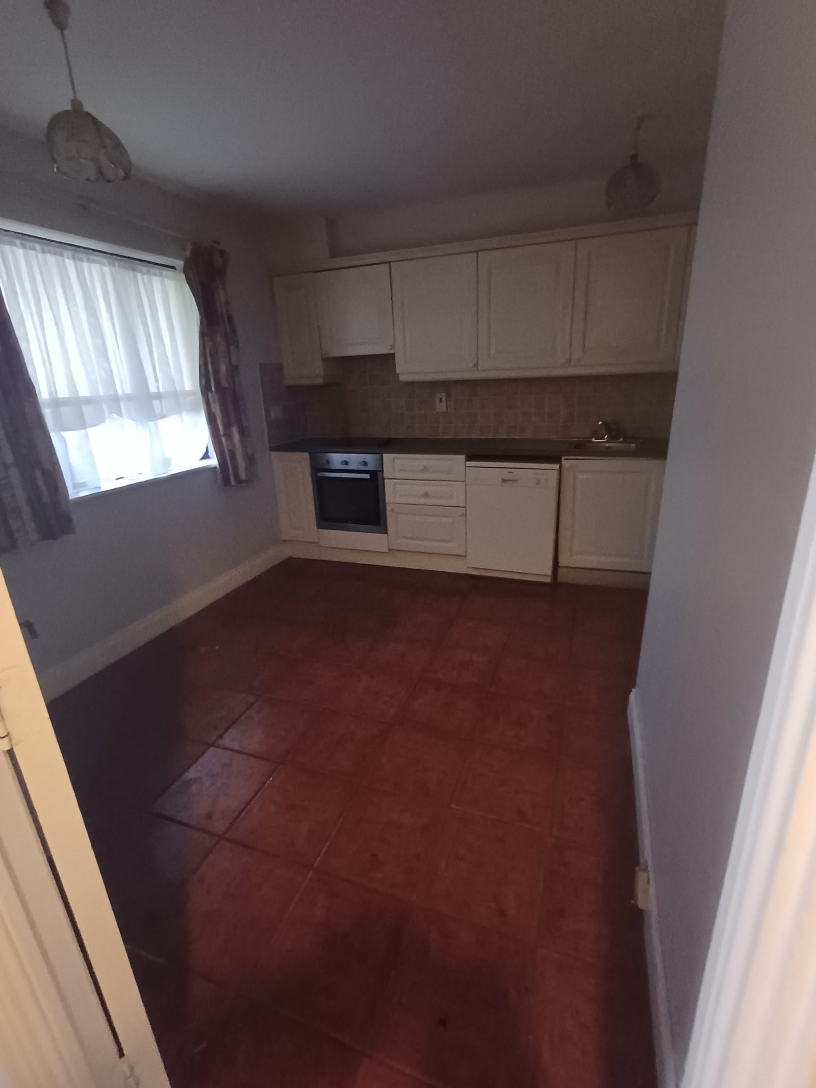 A kitchen cleared of contents during a house clearance